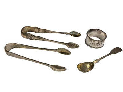 Lot 48 - Pair of Georgian silver sugar tongs, one other silver pair, Victorian silver spoon and a silver napkin ring (4)