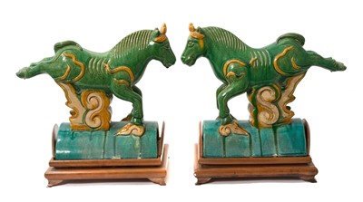 Lot 222 - Pair of Chinese green glazed roof tiles, on wooden presentation bases
