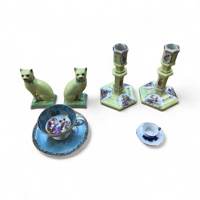 Lot 5120 - Pair of Victorian style Staffordshire cats, pair of German porcelain candlesticks and two cabinet cups and saucers