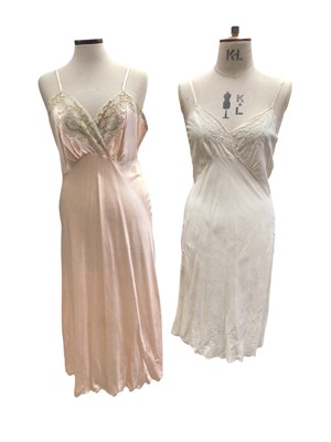 Lot 2509 - Small group of c.1930s lingerie including three pretty silk slips, embroidery and lace negligee, green silk pyjamas and a embroidered cream silk house coat / dressing gown.