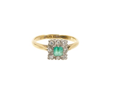 Lot 639 - Emerald and diamond cluster ring with a square cut emerald surrounded by a border of nine brilliant cut diamonds in platinum setting on 18ct gold shank
