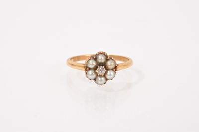 Lot 663 - Victorian pearl and diamond daisy head cluster ring