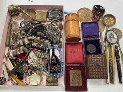 Lot 908 - Group of vintage beads, buckles, silver thimbles, cased medallions, two agate and copper trinket boxes, pens and other bijouterie