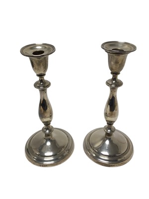 Lot 353 - Pair of George III style silver candlesticks, with baluster stems Birmingham 1921/1922