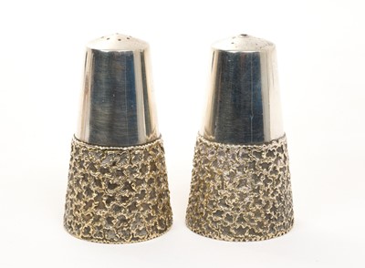 Lot 358 - Pair of silver and parcel gilt salt and pepper pots, London 1975. Stuart Devlin 7.2cm high