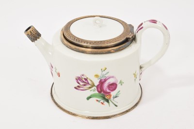 Lot 244 - Early 19th century Vienna porcelain teapot, repaired with fine quality silver-gilt mounts, the porcelain body decorated with polychrome flowers. Underglaze and painted marks. 9.5cm high