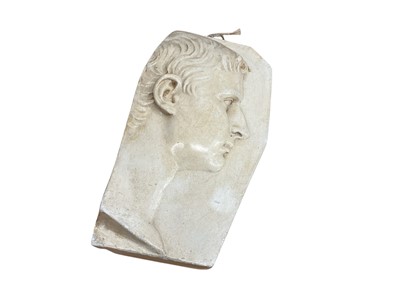 Lot 257 - Early to mid-20th century Grand Tour type plaster plaque, in the form of a marble fragment, depicting Augustus Caesar. 34cm high