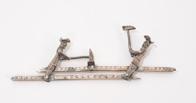 Lot 852 - Dutch silver mechanical toy, of two woodcutters, 11cm wide, Amsterdam mark