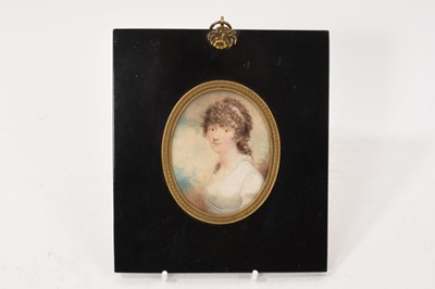 Lot 974 - Late 18th century watercolour portrait miniature of a young lady, wearing her hair up in curls and a thin white blouse. In original ebonised frame, the backing paper with ink inscript...