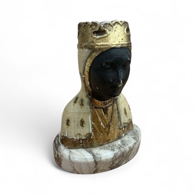 Lot 258 - 19th century Grand Tour plaster bust of the Virgin Madonna of Montserrat, painted in polychrome and gilt, on its oval marble base. 14cm high