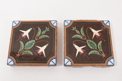 Lot 249 - AWN Pugin for Mintons, pair of 19th century square tiles, decorated with fuchsias and quarter florets on corners, incised makers marks and nine stabbed holes verso. 10.2cm. (2