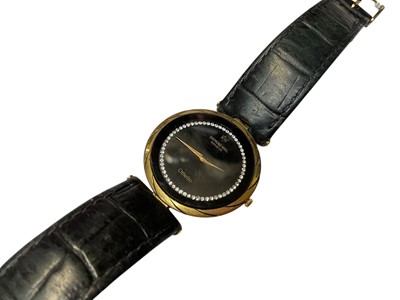 Lot 249 - Ladies' Raymond Weil Othello wristwatch with a crystal set black circular dial in a gold plated case, 30mm diameter, on a black leather strap