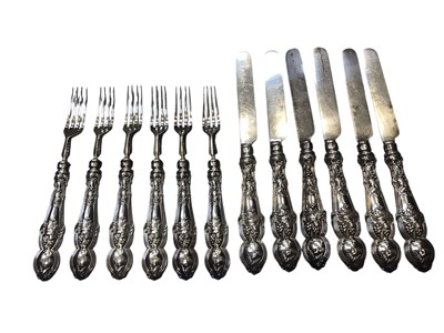Lot 78 - Set of twelve Victorian silver dessert knives and forks with grape vine decoration to the handles (Sheffield 1859)