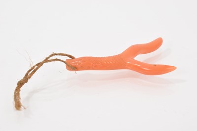 Lot 697 - Antique Chinese coral pendant carved with a horse head, the mane spreading down the stem to forked terminals, 42mm