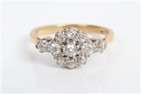 Lot 3470 - Gold (18ct) diamond flower-head cluster ring...