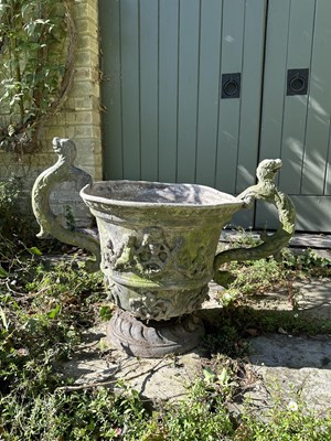 Lot 1932 - 18th / 19th century lead planter, classical form with twin scroll mythical formed handles, on circular base, 54cm high overall