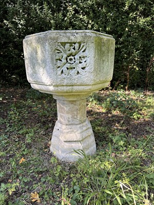 Lot 1940 - Good antique carved stone font of octagonal form with four leaf carved panels, on octagonal columns and stepped base, 67cm wide x 100cm high
