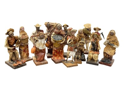 Lot 131 - Collection of Mexican papier mâché and composite figures, each approximately 30cm high. (14) Provenance: Estate of John Burton (1944-2022), renowned conservationist and ecologist, founder of the...