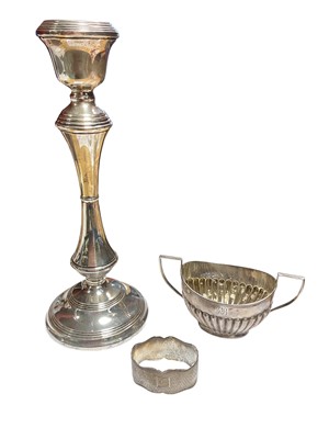 Lot 61 - Silver candlestick, silver two handled suagr bowl and a silver napkin ring (3)