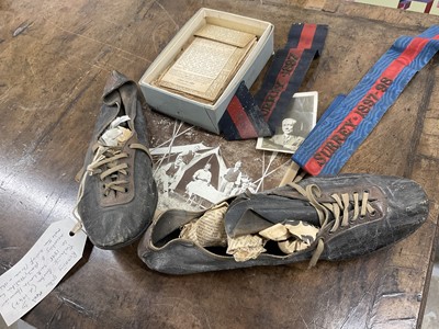 Lot 159 - Pair of late 19th / early 20th century homemade running spikes, with related photograph, team colours and an album of related press cuttings