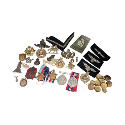 Lot 709 - Second World War medals comprising 1939-1945 Star, France and Germany Star, Defence and War medals, together with various cap badges and buttons to include some Wartime Economy issue examples.