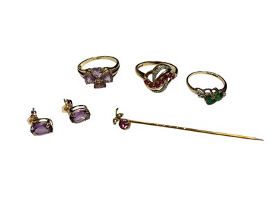 Lot 130 - Three 9ct gold gem set dress rings, pair of amethyst stud earrings (stamped 10k) and 9ct gold gem set stick pin