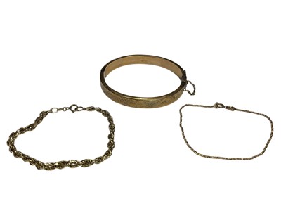 Lot 131 - 9ct gold hinged bangle and two 9ct gold bracelets (3)