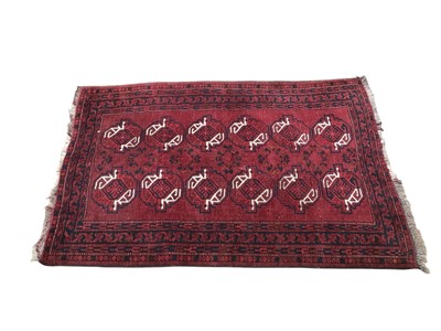 Lot 5304 - Red Afghan rug measuring approximately 168cm X 101cm