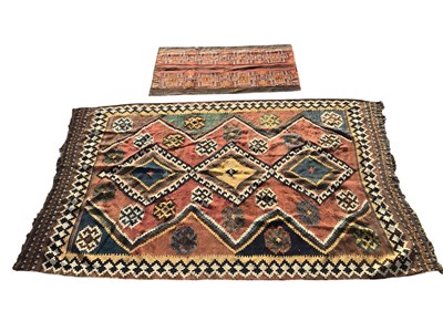 Lot 5306 - Kelim rug on red ground measuring approximately 236cm X 155cm together with a small rug/prayer mat