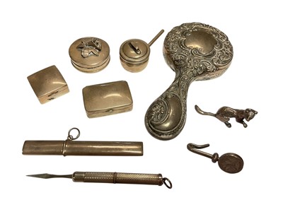 Lot 134 - Group of silver pill pots, miniature silver backed mirror, silver propelling toothpick, miniaure silver model ferret and other silver items