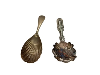 Lot 135 - Georgian silver caddy spoons with engraved decoration (Birmingham 1824) and one other silver caddy spoon (Sheffield 1953)