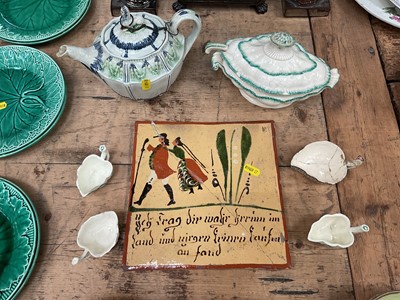 Lot 19 - Pearlware teapot with sphinx knop, together with four creamware butter boats, a creamware sauceboat, and an interesting continental tile
