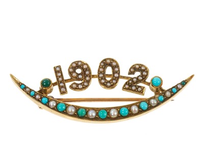 Lot 598 - Edwardian turquoise and seed peal crescent brooch 1902