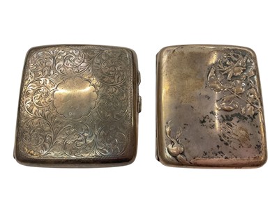 Lot 918 - 1920s silver cigarette case with engraved foliate scroll decoration and a French white metal cigarette case with a rose design (2)