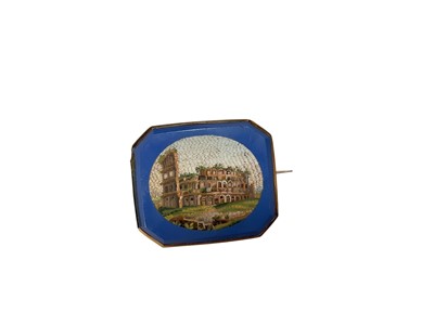 Lot 12 - 19th century Italian micro-mosaic brooch depicting The Colosseum, Rome, on a blue ground in a yellow metal brooch mount
