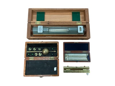 Lot 2951 - Group of scientific instruments, including a Cooke, Troughton & Simms cased spirit level, a cased hydrometer and cased set of thermometers by J. Hicks, London, (1 box).