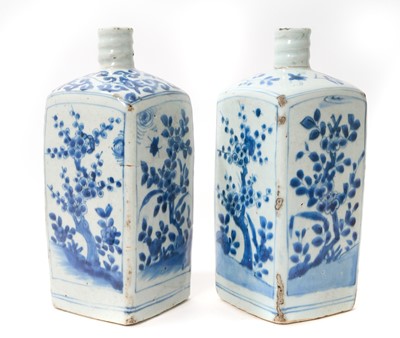Lot 226 - Two Chinese late Ming / Wanli blue and white porcelain bottles, of square form, decorated with foliage and insects, 25.5cm high
