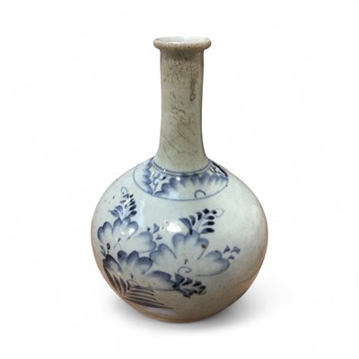 Lot 5021 - Japanese blue and white porcelain bottles vase, probably Edo period, painted with flowers, 26cm high