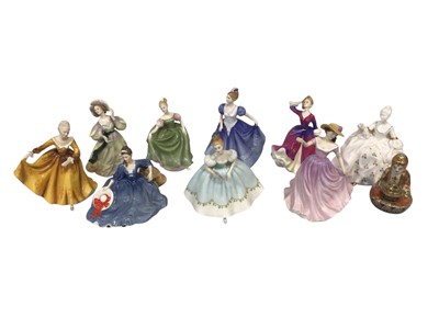 Lot 5027 - Nine Royal Doulton figures and a Japanese Buddha