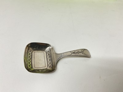 Lot 214 - George III silver caddy spoon with bright cut engraved decoration, Birmingham 1811