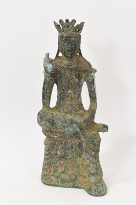 Lot 987 - Chinese bronze figure of a seated deity, her right arm raised