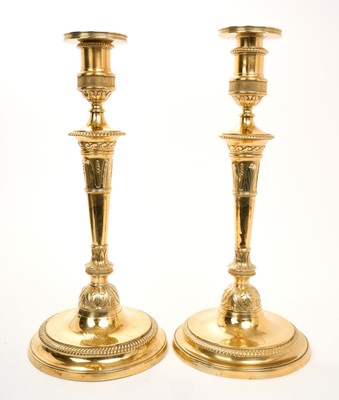 Lot 456 - Pair of George III silver gilt candlesticks