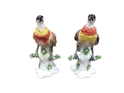 Lot 744 - Pair of German porcelain models of birds on tree-stumps