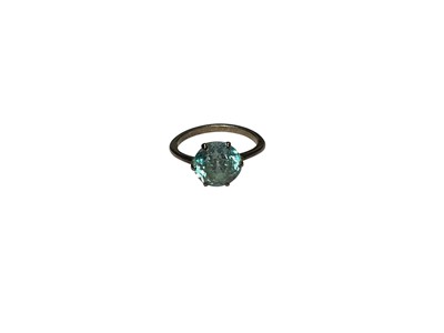 Lot 20 - Blue zircon single stone ring in six claw setting on white metal shank