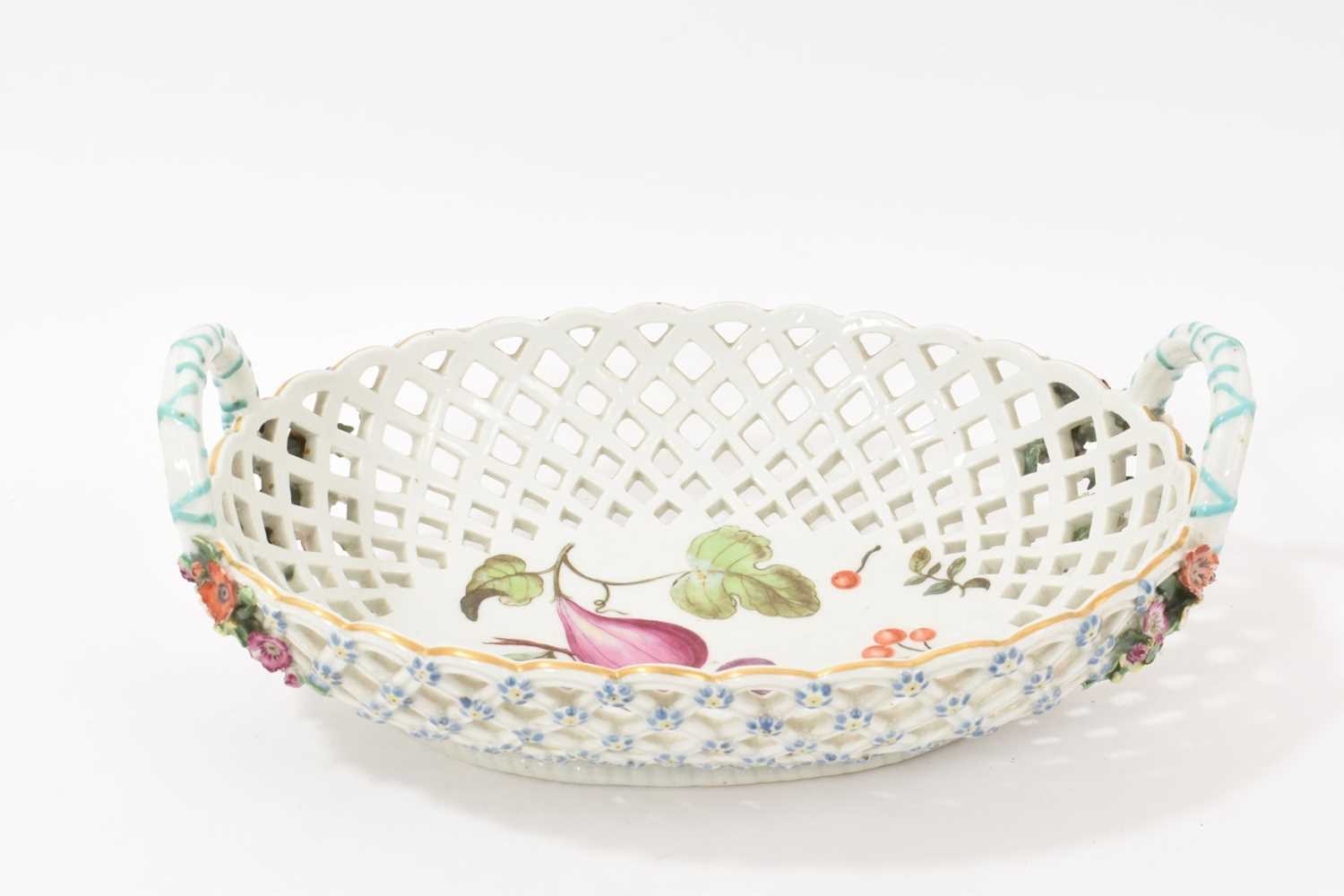 Lot 49 - Chelsea large oval two handled basket, painted with fruits, circa 1760