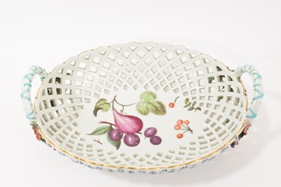 Lot 49 - Chelsea large oval two handled basket, painted with fruits, circa 1760