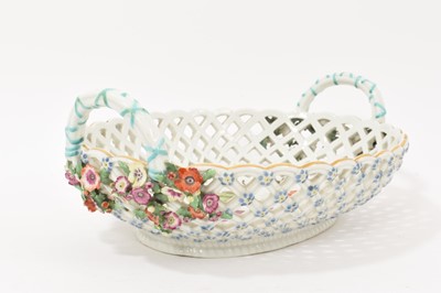 Lot 49 - Chelsea large oval two handled basket, painted with fruits, circa 1760