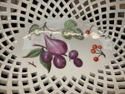 Lot 49 - Chelsea large oval two handled basket, painted with fruits, circa 1760