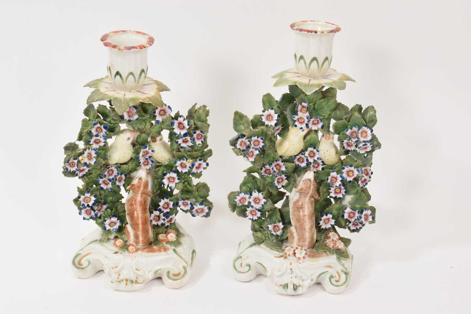 Lot 57 - Pair of Derby ‘birds in branches’ candlesticks