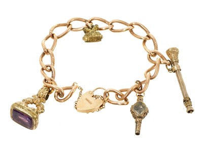 Lot 662 - 9ct gold bracelet with four 19th century gilt metal fobs